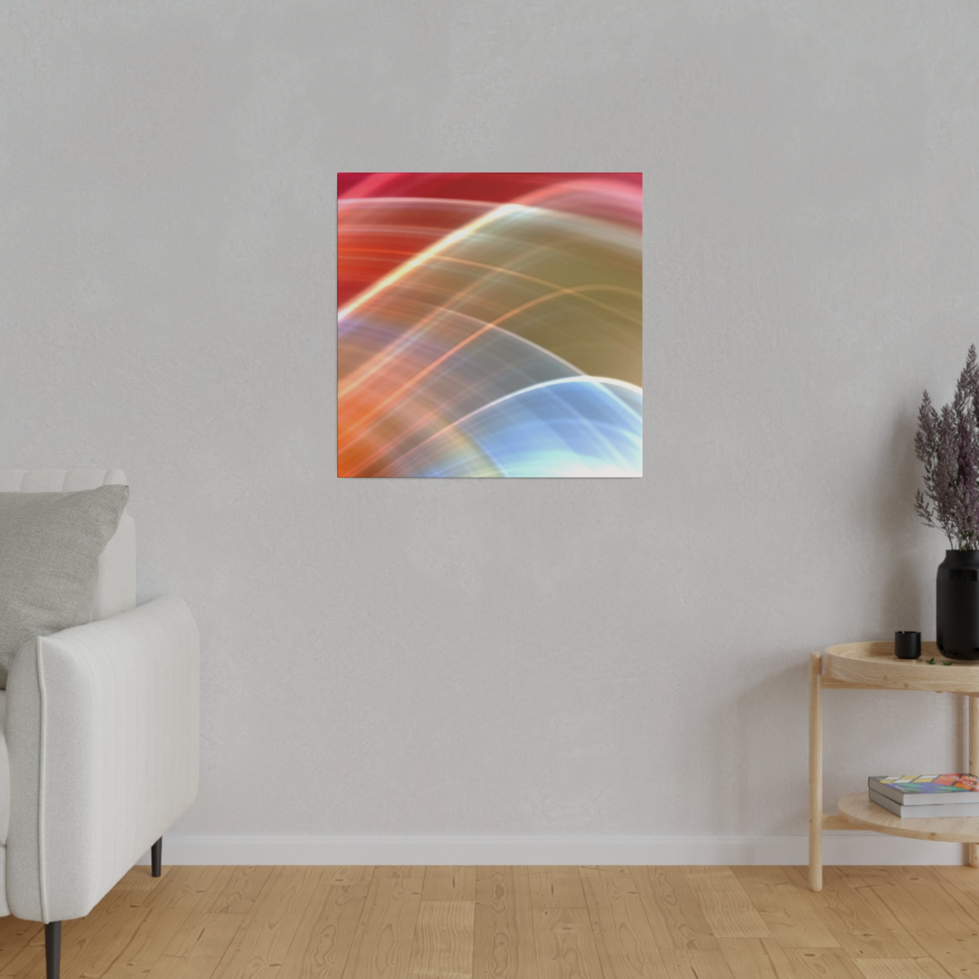 Abstract multicolored curved light trails on a square canvas hanging on a gray wall in a living room.