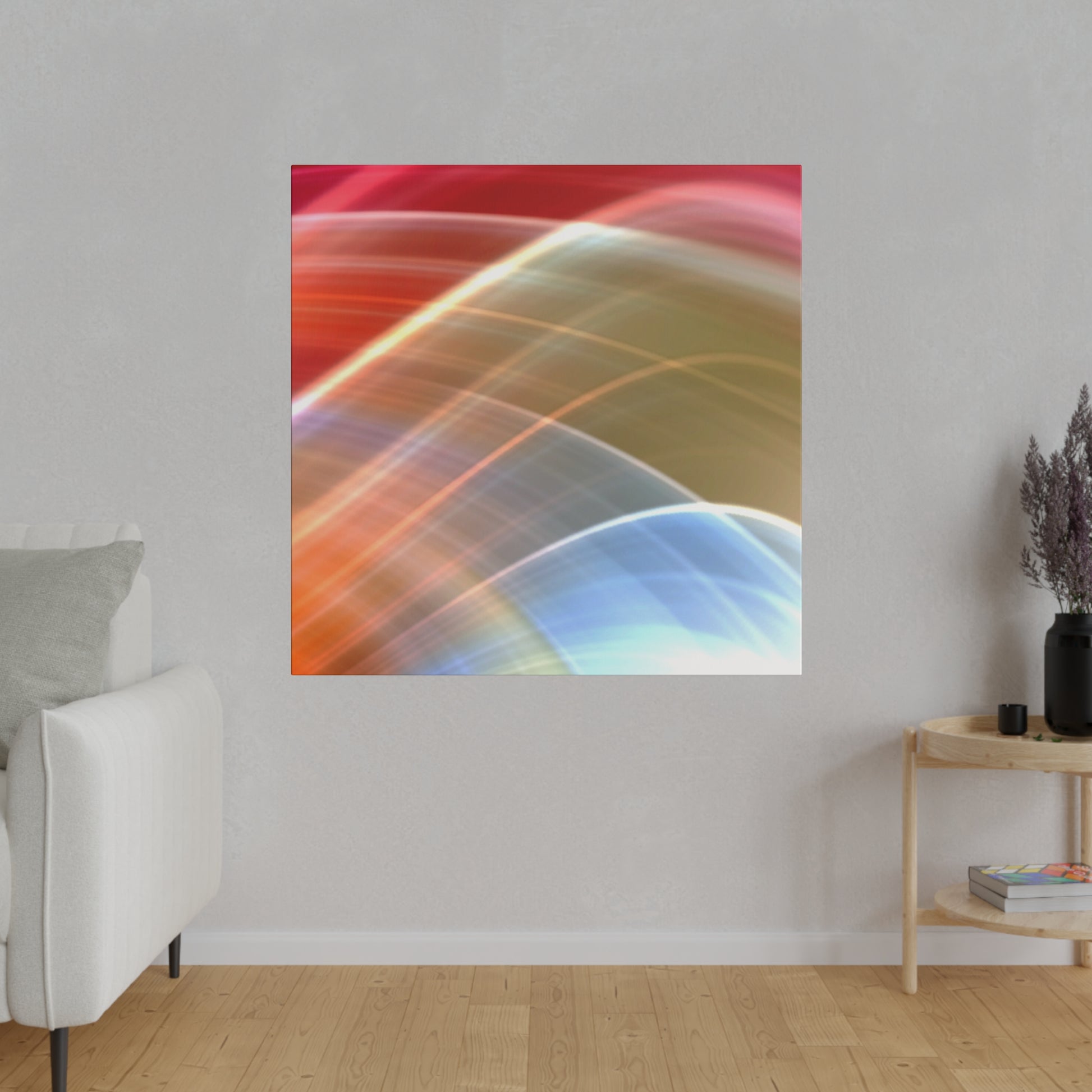 Abstract square wall art with multicolored curved light streaks in red, orange, blue, and white, hung in a living room.
