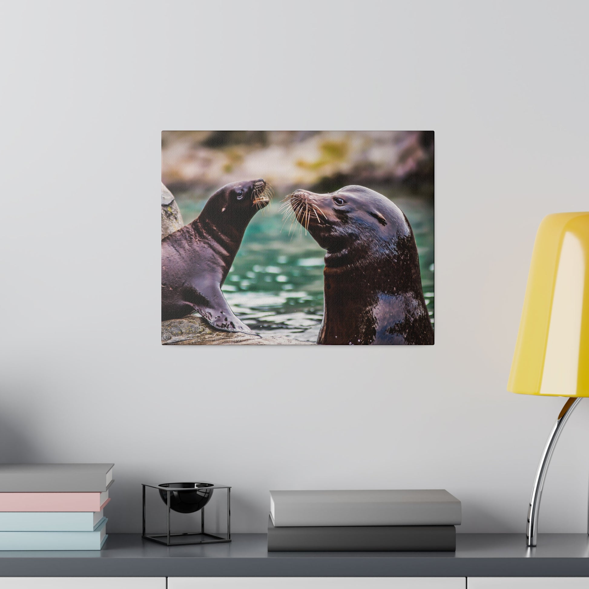 A sea lion having fun in the water, with its whiskers and sleek fur prominently visible. The scene captures the playful and social nature of the animal.