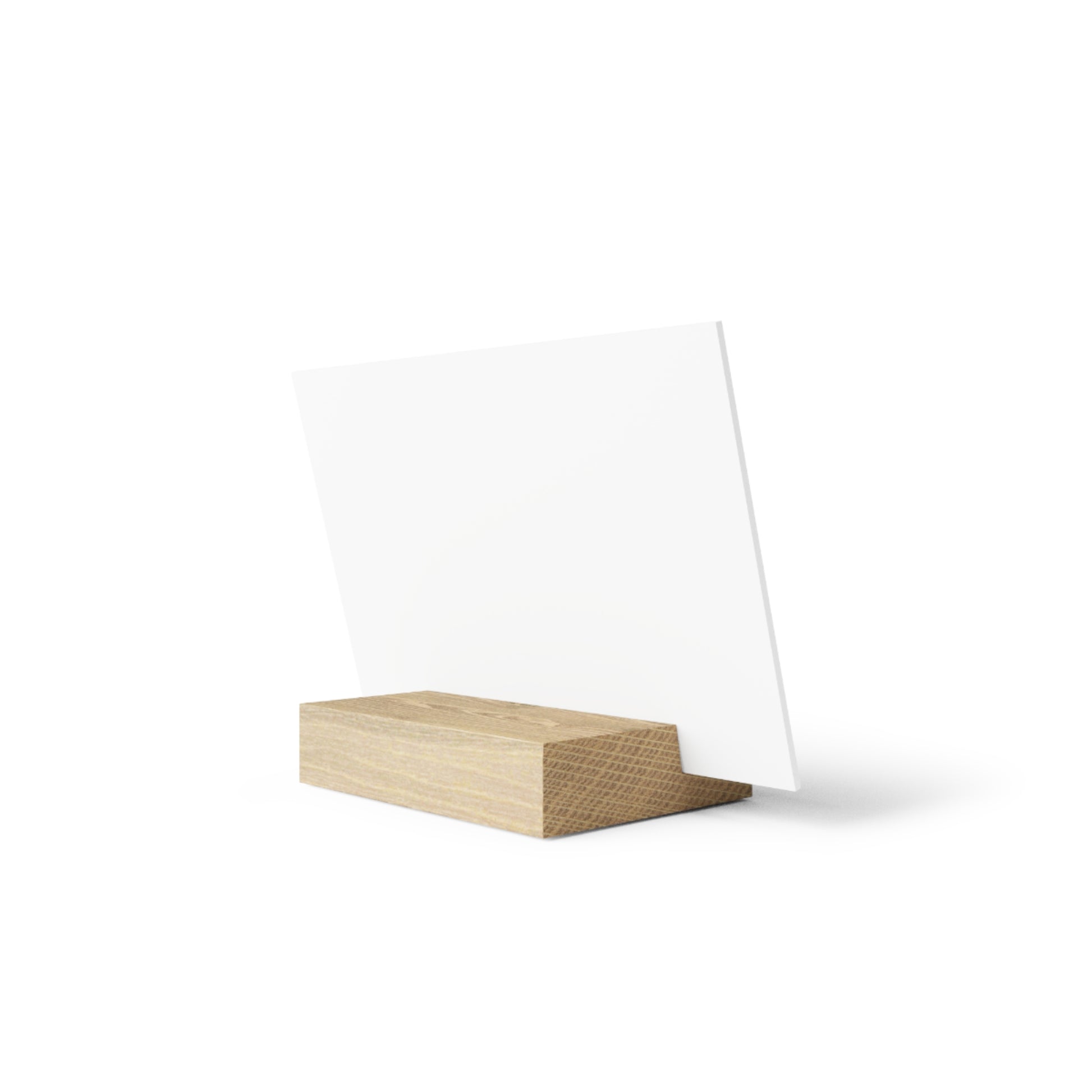 White square card held upright by a light wood rectangular block stand on a white background.