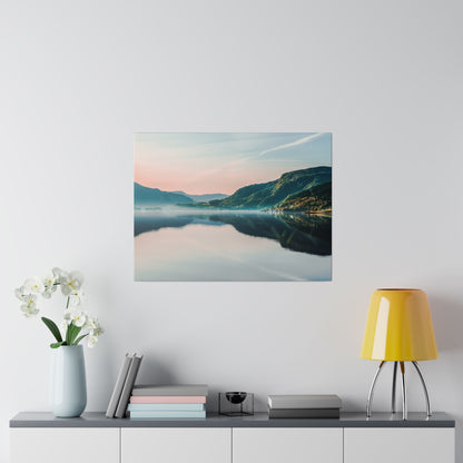 Framed wall art showing a calm lake with a mountain range and pastel sky reflected on the water.