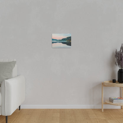 Small landscape painting of a lake and mountains mounted on a light gray wall in a living room.
