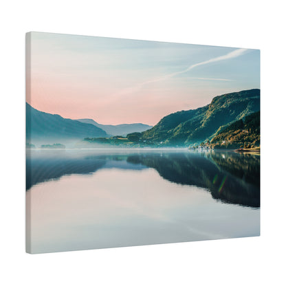 Canvas print of a calm lake reflecting green mountains and a pastel pink-blue sky.