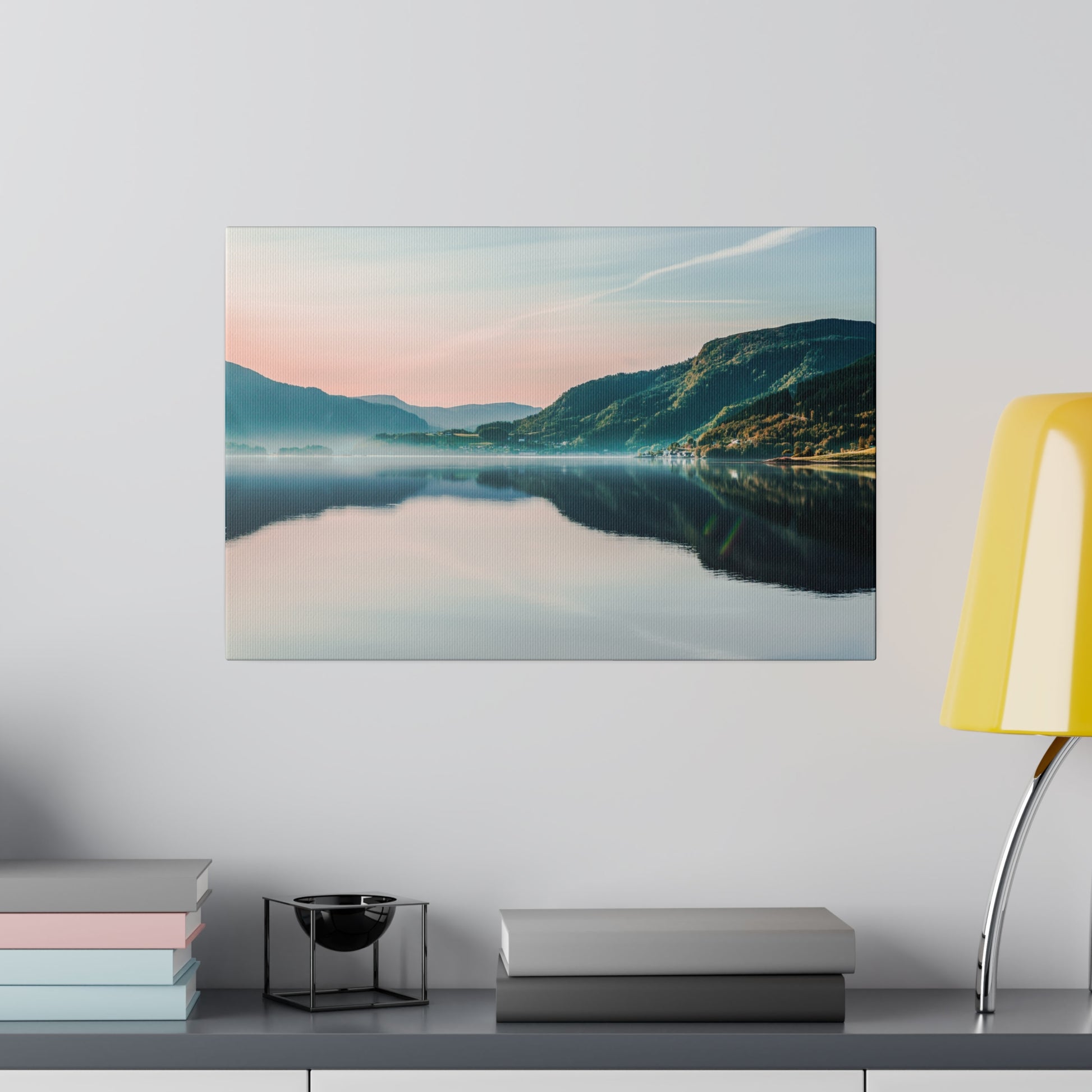 Landscape canvas print of a calm lake with a mountain range and pastel sunrise reflections on the water.