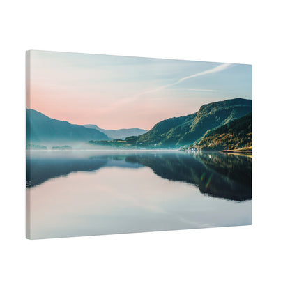 Landscape canvas print depicting a calm lake reflecting surrounding green mountains under a pastel sky.