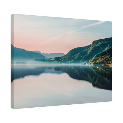 Landscape print of a tranquil lake with green mountains reflected in the calm water under a pastel sky.
