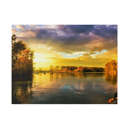 River scene at sunset with golden light reflecting off calm water, autumn trees lining the banks.