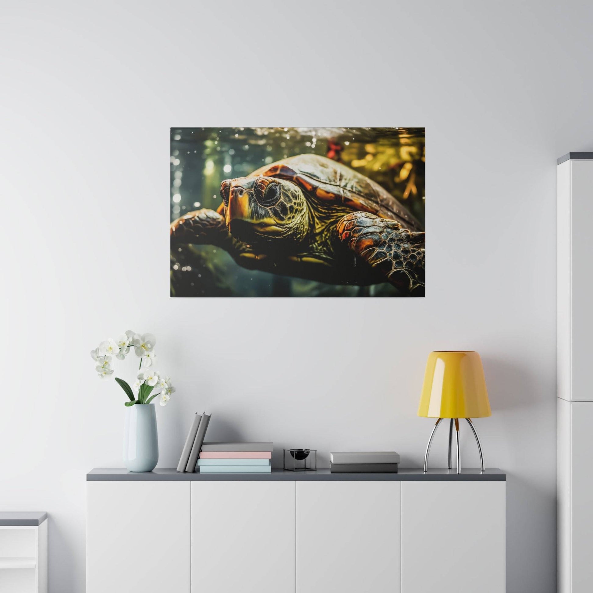 Close-up of a sea turtle canvas print mounted on a light gray wall above a white sideboard.
