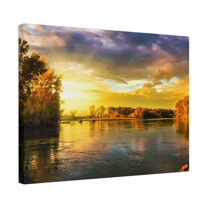 A riverside landscape at sunset with golden-yellow sky and orange trees reflecting on calm water.
