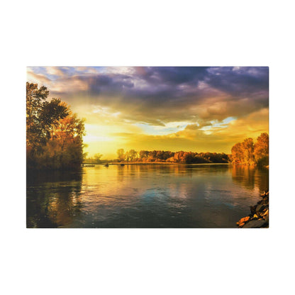 River scene at sunset with orange trees along the banks and a calm, reflective water surface.