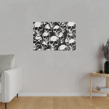 Rectangular black-and-white wall art featuring dense skull illustrations hanging on a light gray living room wall.