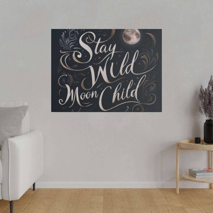Dark navy canvas print with white cursive text “Stay Wild Moon Child” and decorative moons and swirls.