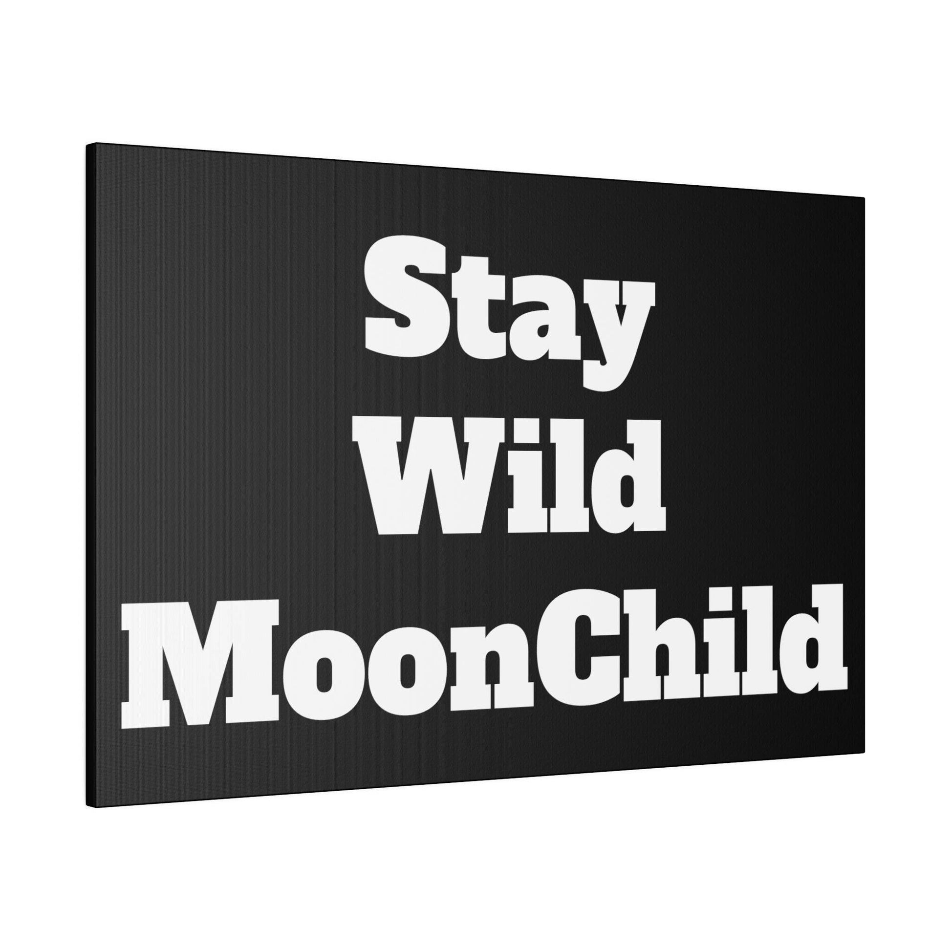 Black canvas print with large white bold text reading “Stay Wild MoonChild” across three lines.