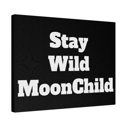 Black canvas print with large white text reading “Stay Wild MoonChild.”