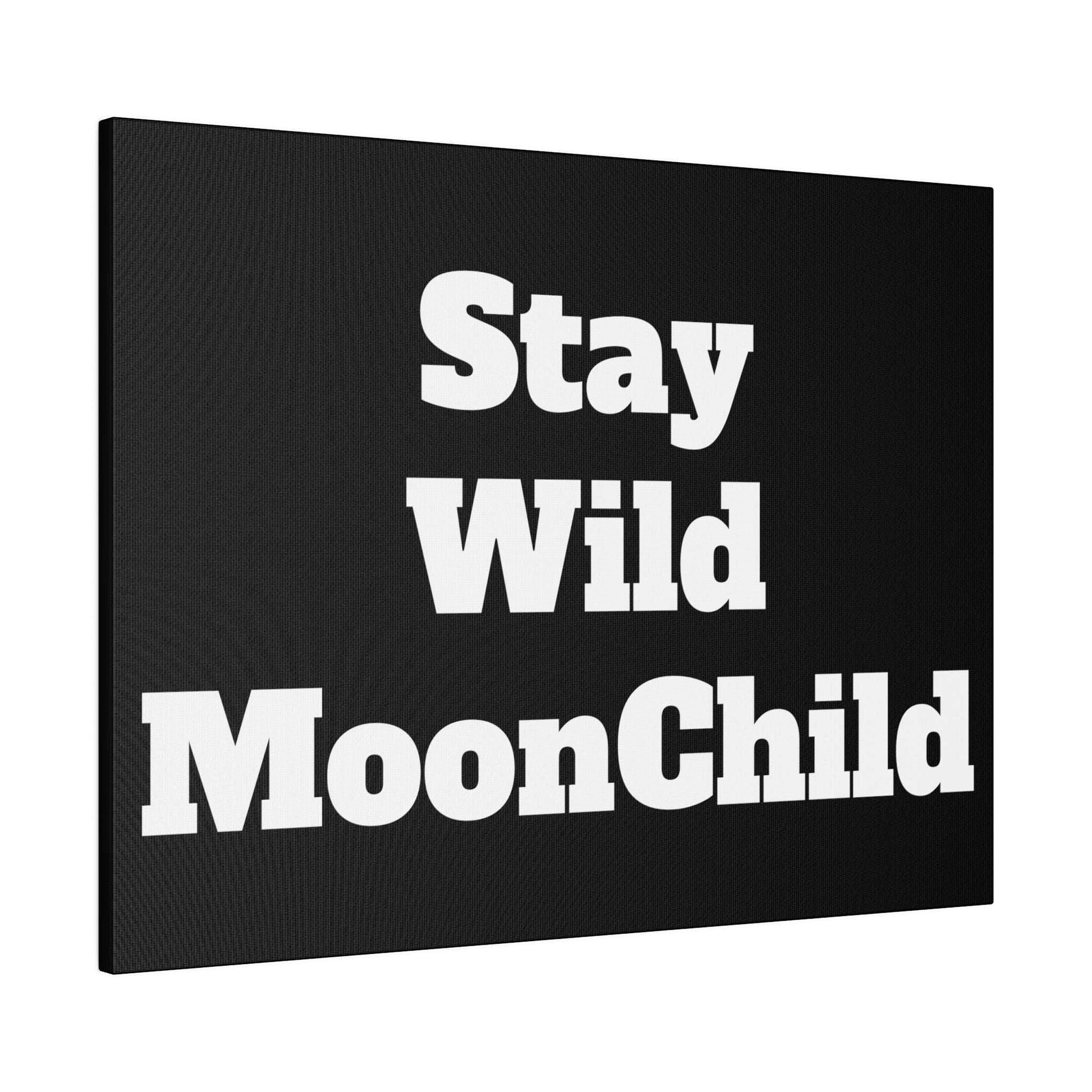 Black canvas wall art with bold white text reading “Stay Wild MoonChild” split across three stacked lines.