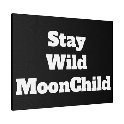 Black canvas wall art with bold white text reading “Stay Wild MoonChild” split across three stacked lines.