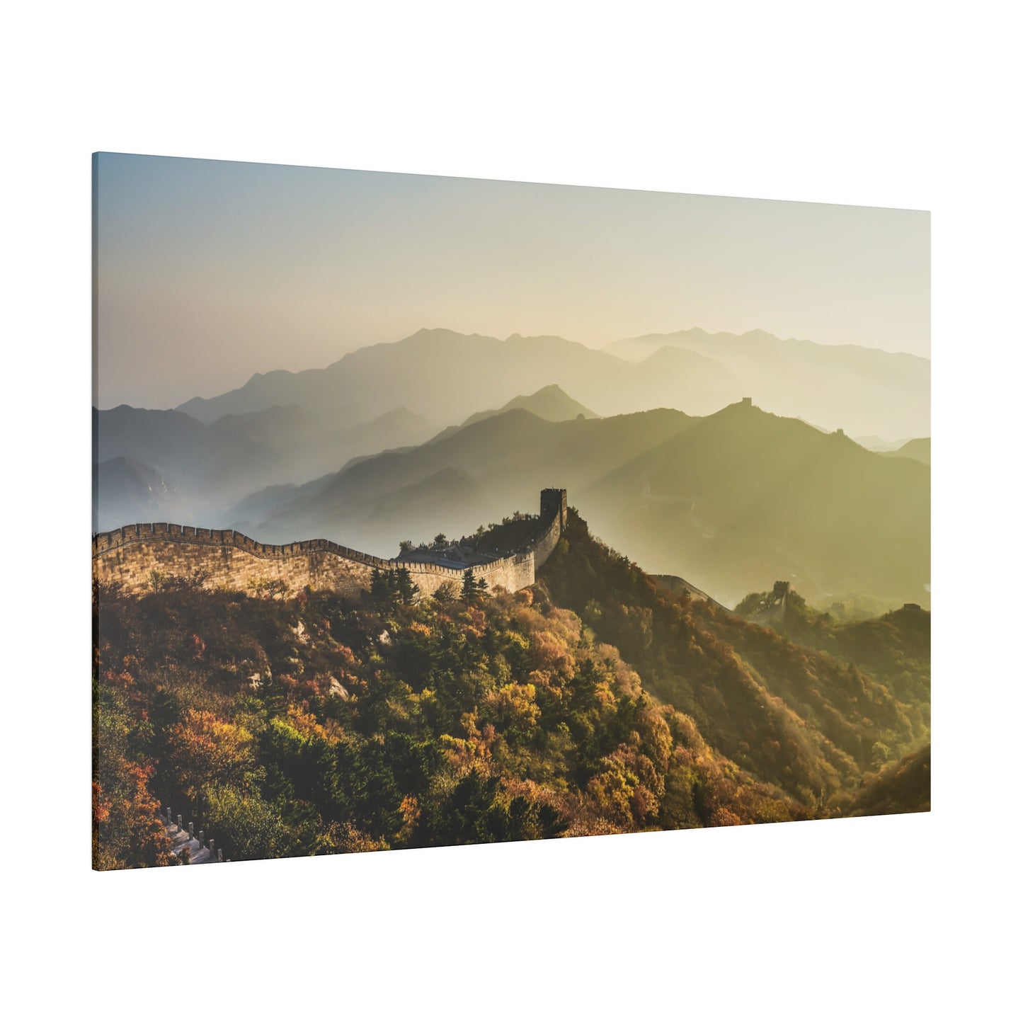 A picturesque sunrise illuminating the peaks and valleys along the Great Wall of China, highlighting its grandeur.