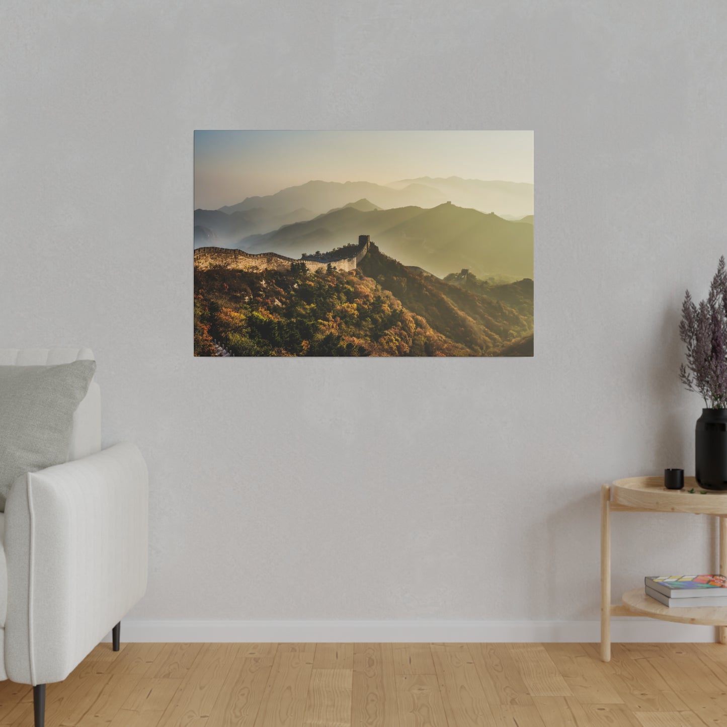 A stunning sunrise casting a warm glow over the Great Wall of China and its mountainous backdrop.