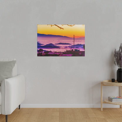 Colorful landscape print of a sunrise over foggy purple hills, with a transmission pole and scattered buildings.
