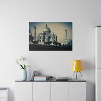 Framed photo of the Taj Mahal with its dome and minarets, hung on a white wall above a modern cabinet.