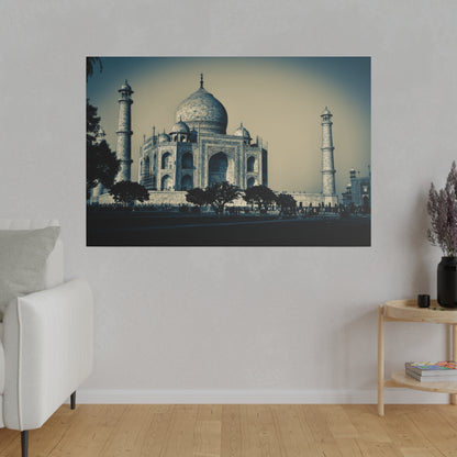 Photograph of the Taj Mahal with its central dome and two of the four minarets, shown in cool blue tones.