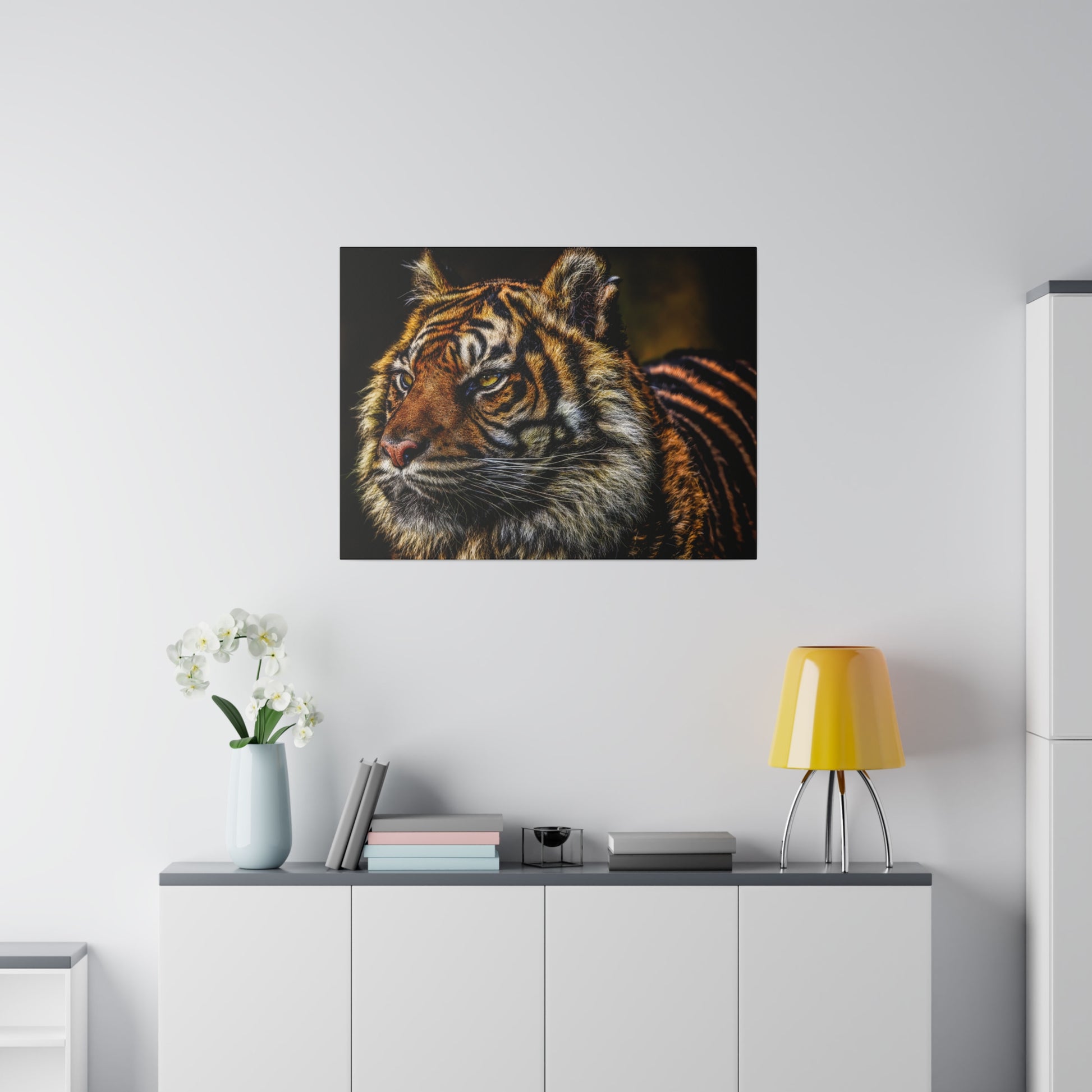 A close-up view of a tiger's face, highlighting its facial features and the intensity in its eyes. The detailed portrait captures the tiger's majestic and powerful presence.