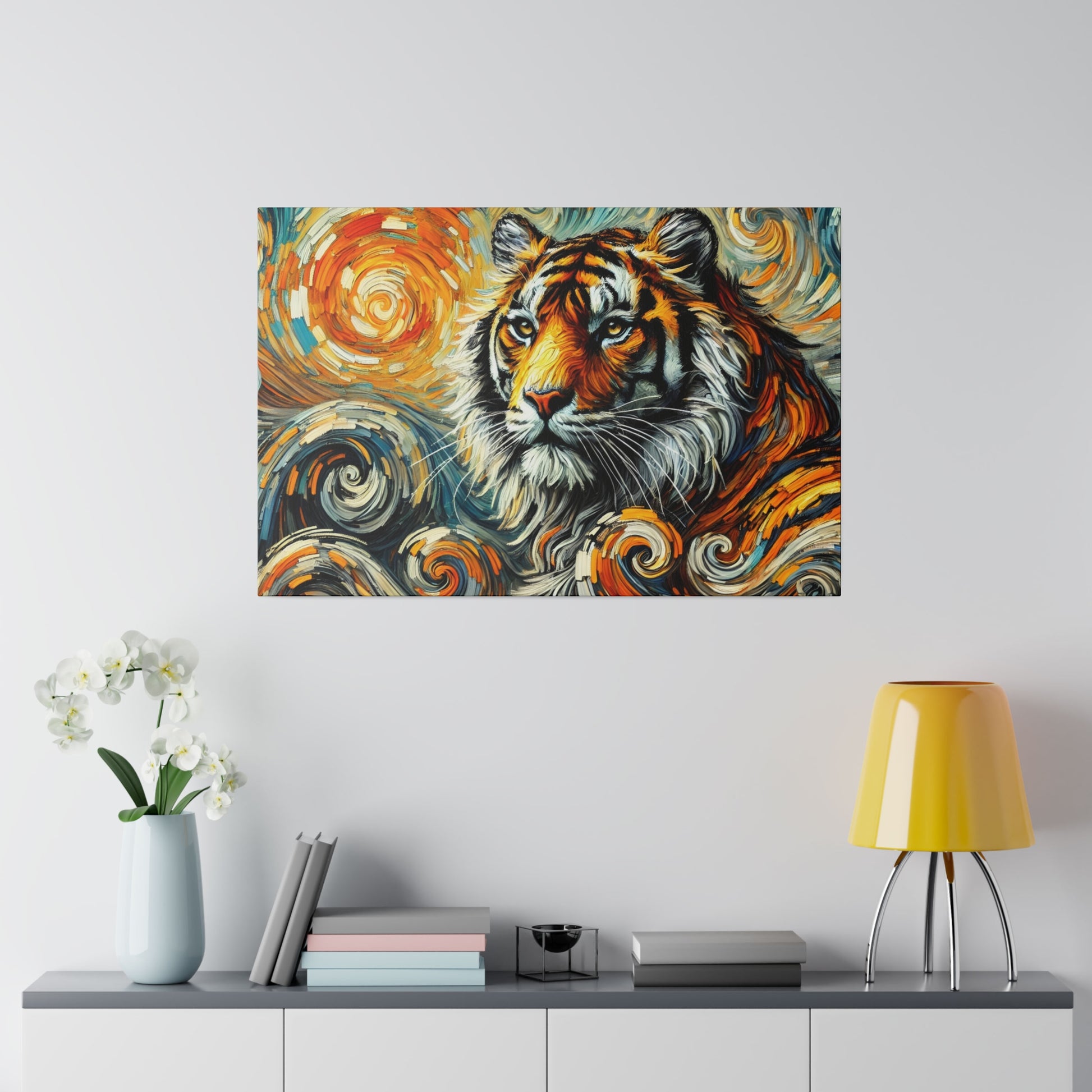 Colorful abstract tiger painting hung on a light gray wall above a white console with books and a yellow lamp.