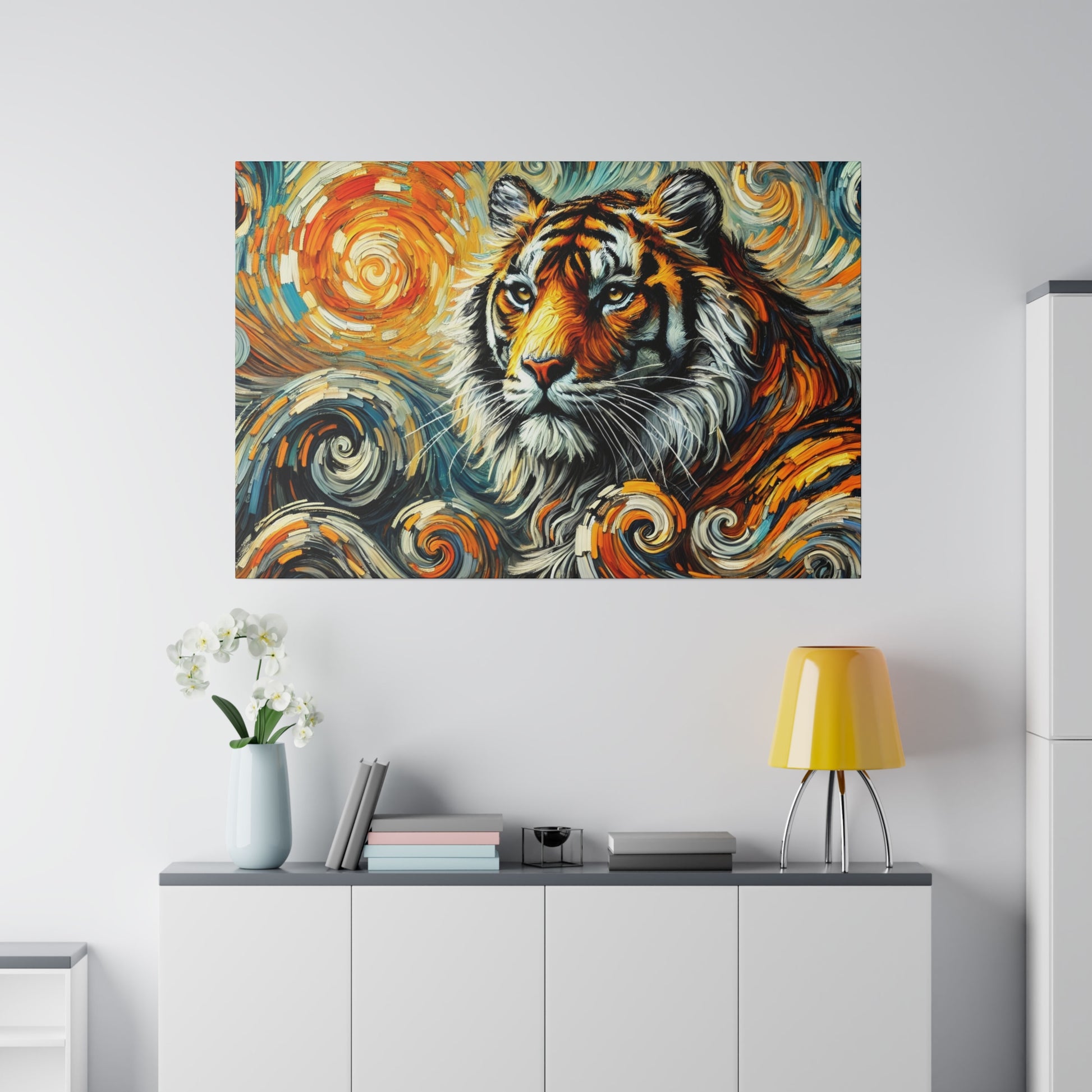 Colorful tiger painting with swirling orange and blue patterns mounted above a white cabinet with a vase, books, and a yellow lamp.