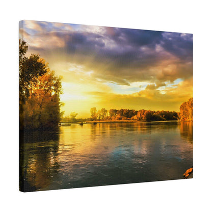 A calm river at sunset, with golden sky reflecting on the water and autumn trees along the shoreline.