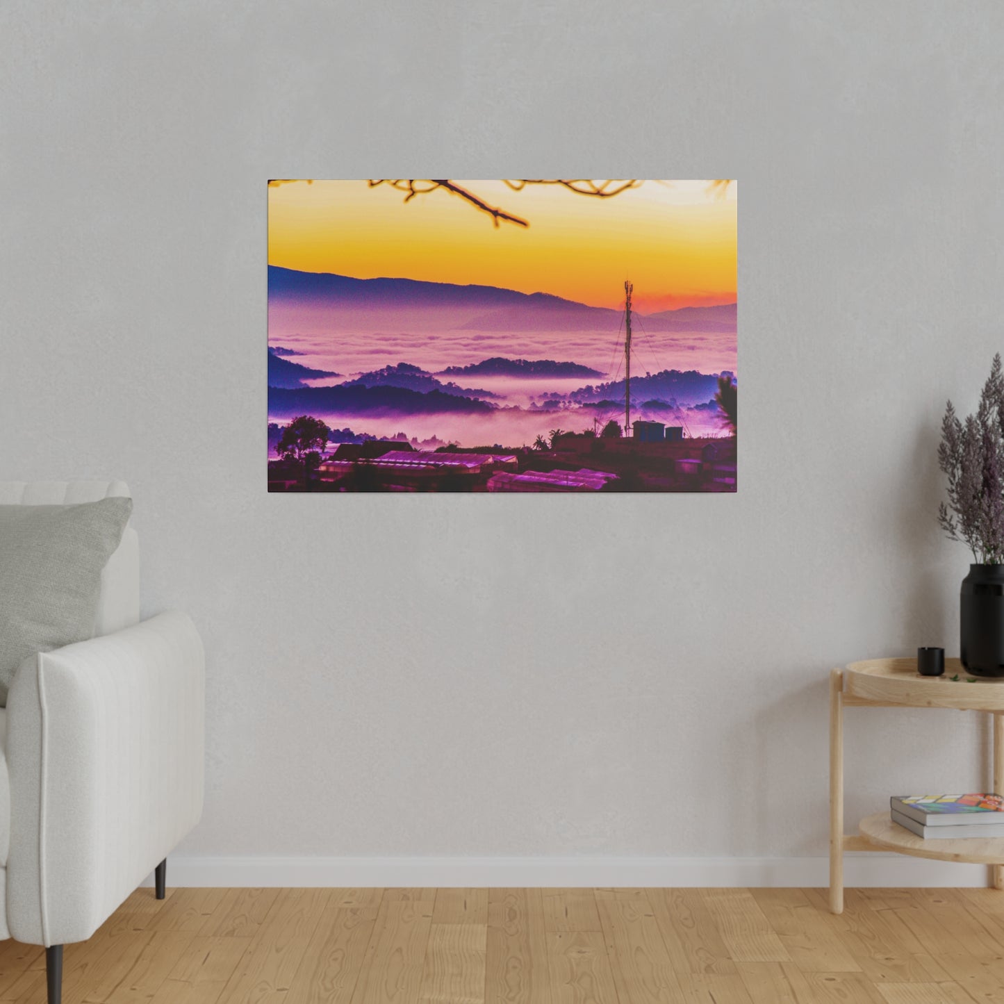 A tranquil sunrise over the mountains, with mist enveloping the landscape and the sky glowing in a peaceful blend of purple and orange tones.