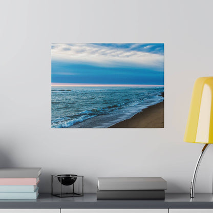 Square canvas painting of a blue ocean beach with waves washing onto a sandy shore under a cloudy sky.