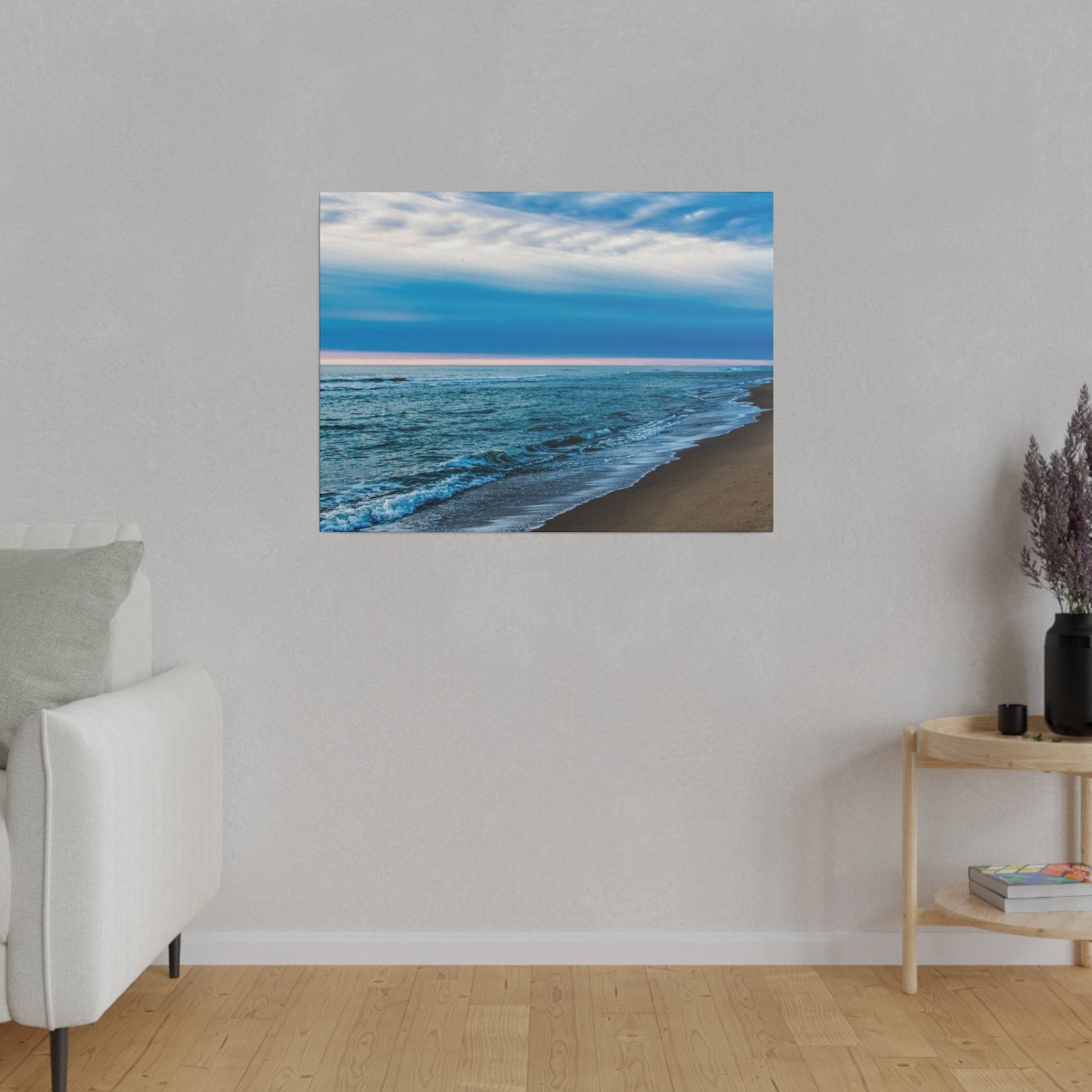 Blue ocean shoreline print with waves on a sandy beach, hung