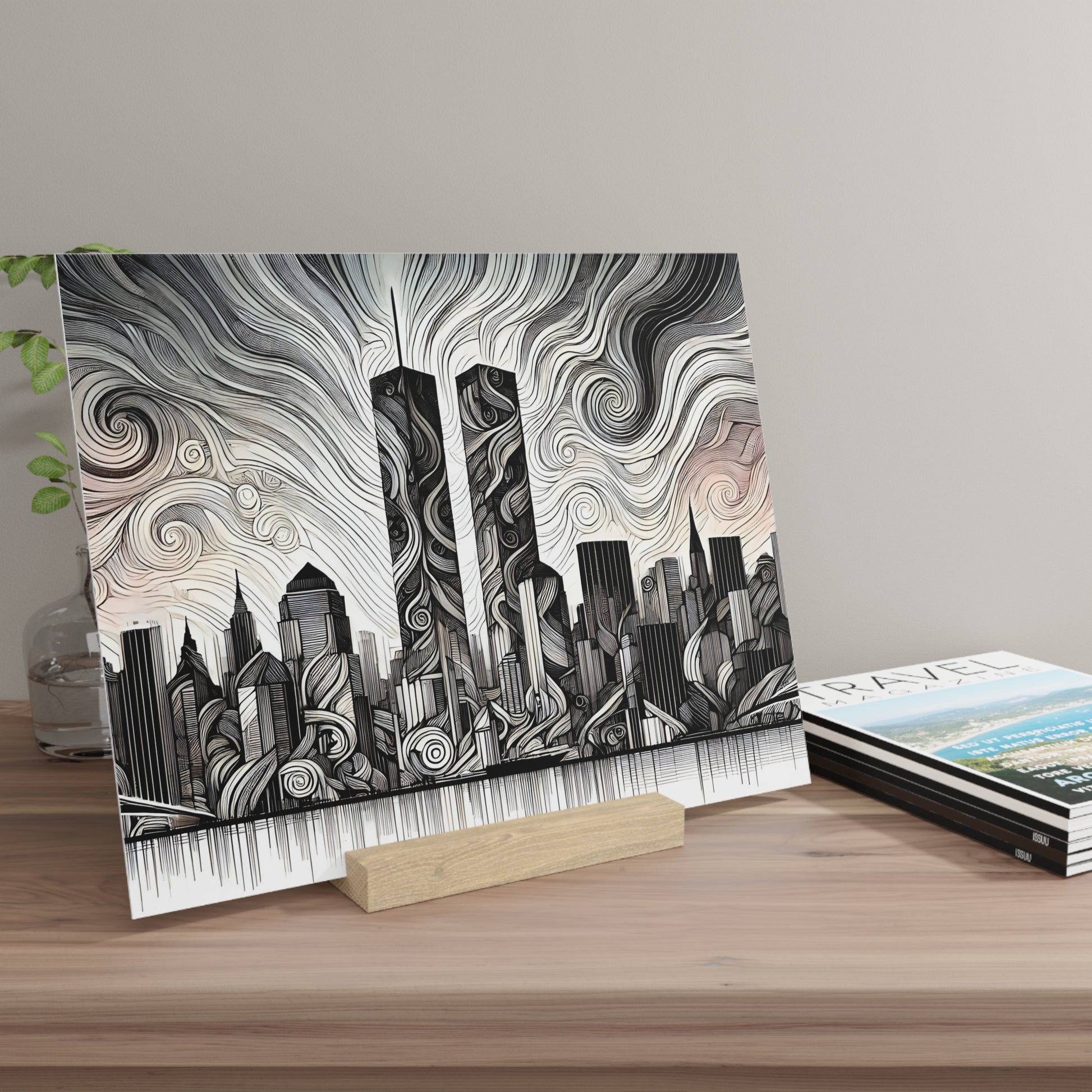 Black-and-white city skyline print with swirling sky patterns, resting on a small wooden stand on a light wood tabletop.