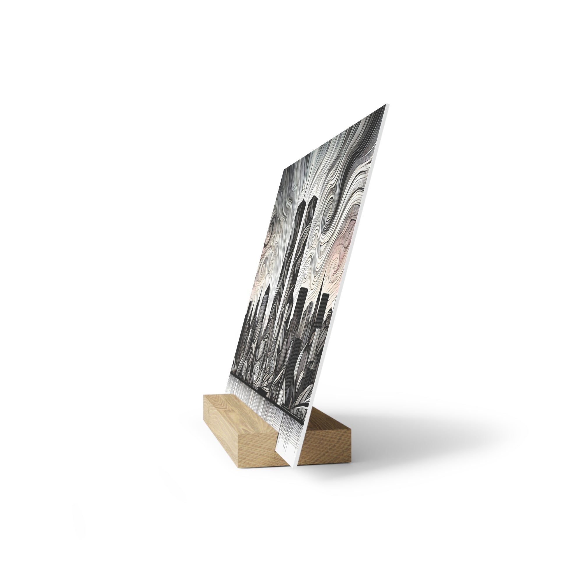 Slanted art print on a light wood easel stand featuring a grayscale, swirled abstract pattern.