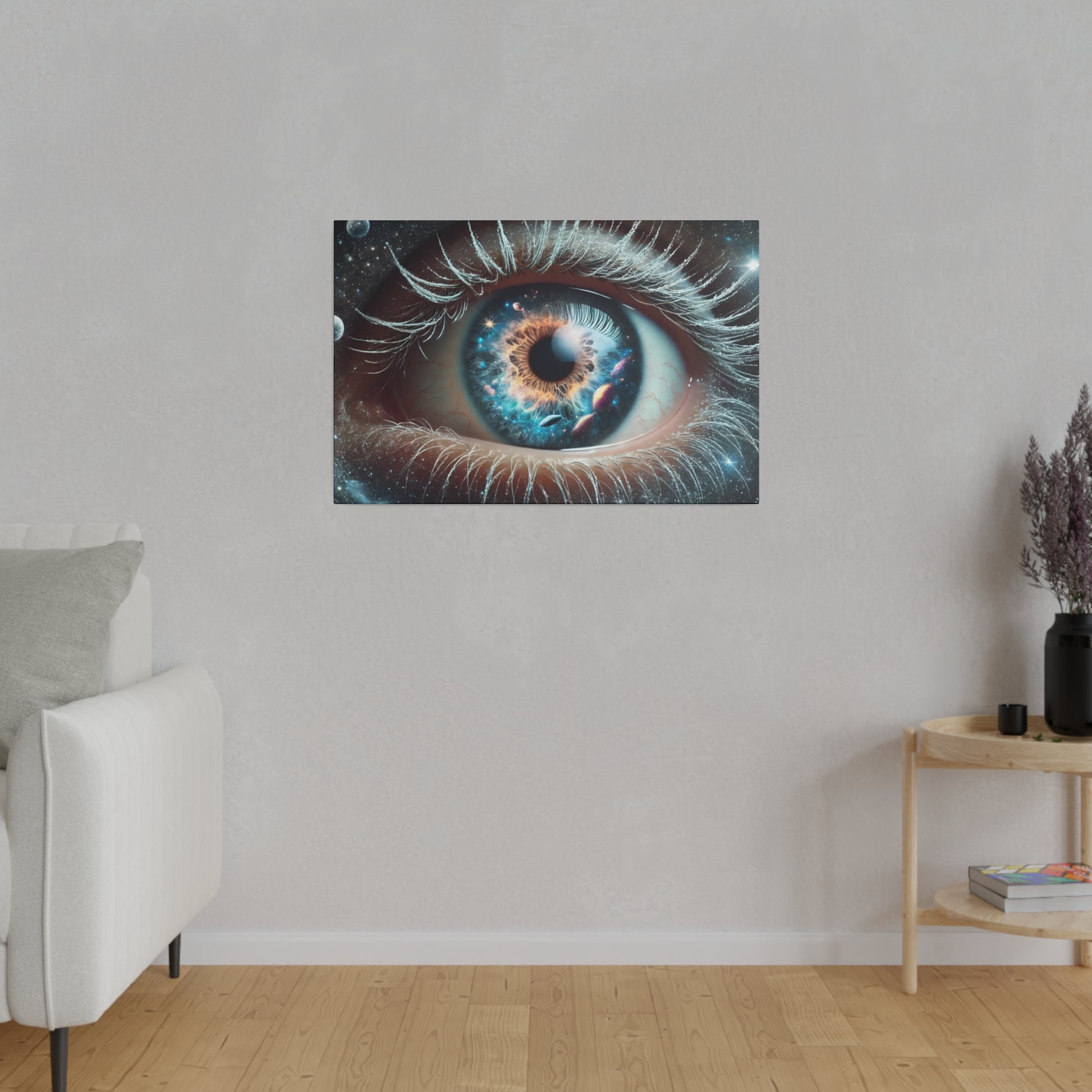 Close-up wall art of a blue iris with detailed eyelashes, mounted on a light-gray wall above a wooden side table in a minimalist living
