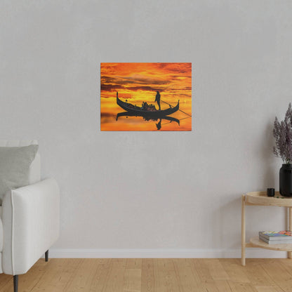 Rectangular wall art showing a silhouetted gondola with passengers and a gondolier on orange sunset water.