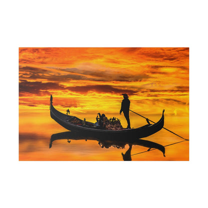 Silhouette of a gondola with passengers and a gondolier on orange sunset water, reflecting in the calm surface.