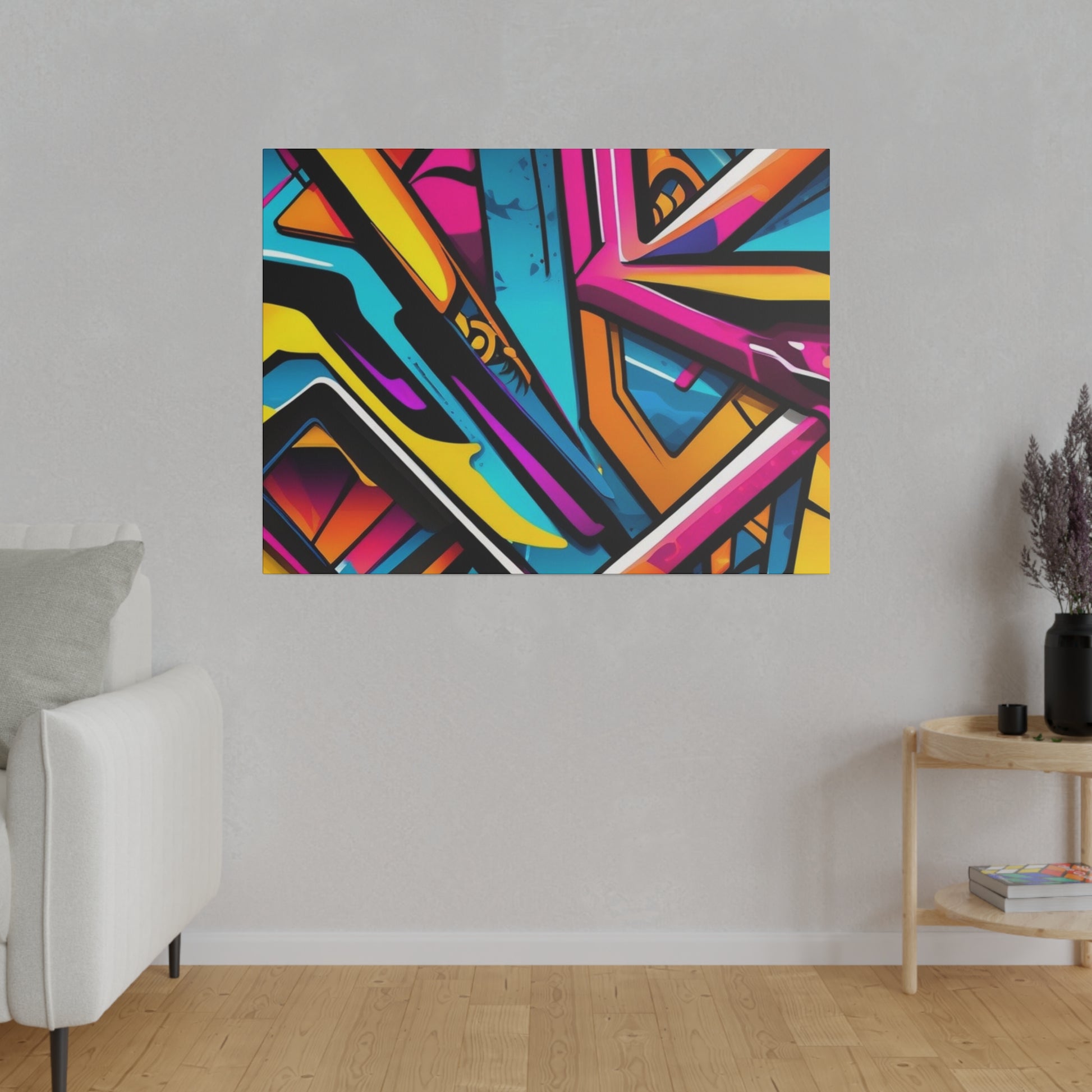 Abstract graffiti painting in bright blue, pink, yellow, orange, and black on a wall above a wooden side table in a living room.