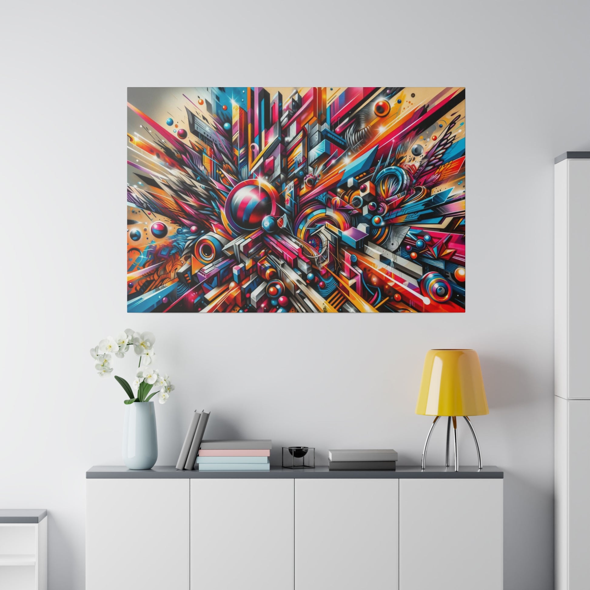 Colorful abstract geometric wall art hung above a white cabinet in a modern living room.