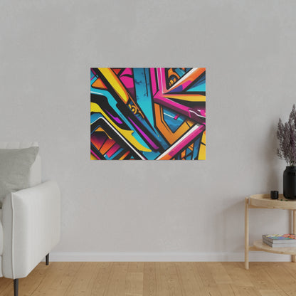 Colorful abstract graffiti artwork in a rectangular frame mounted on a light gray wall.