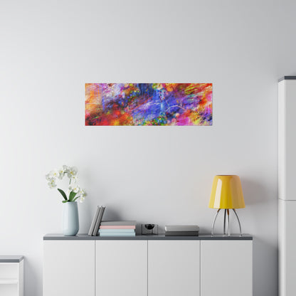 Rectangular abstract painting with red, blue, yellow, and purple splashes hangs on a white wall above a white cabinet.