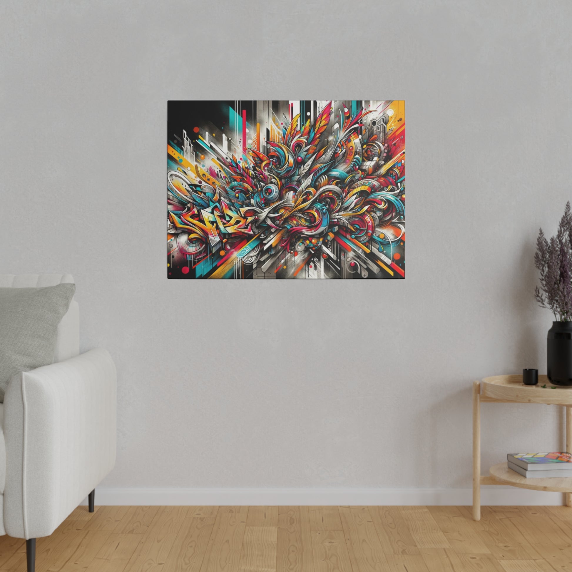 Abstract graffiti-style painting with bright reds, blues, yellows mounted on a light gray wall above a white sofa in a living room.