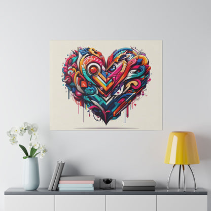 Colorful graffiti-style heart artwork on beige canvas, hung above a cabinet with a vase, books, and a yellow table lamp.