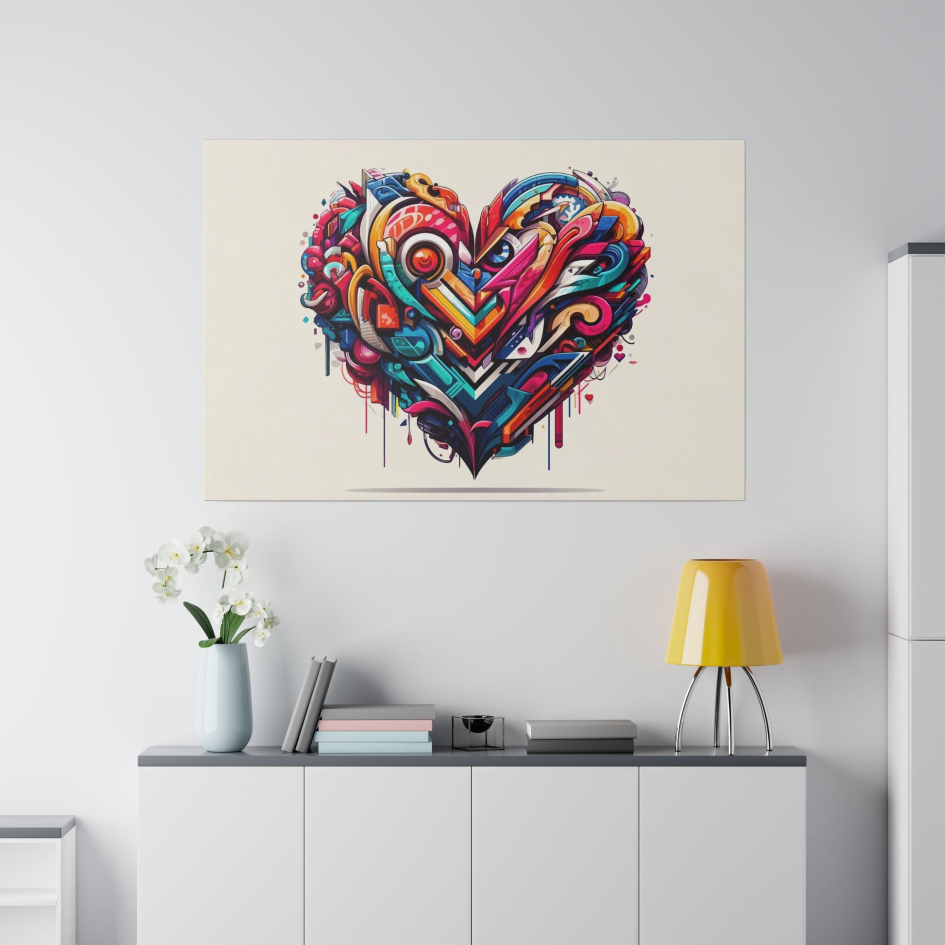 Vibrant graffiti-style heart mural with layered geometric and swirled shapes in red, blue, yellow, and pink above a white cabinet.