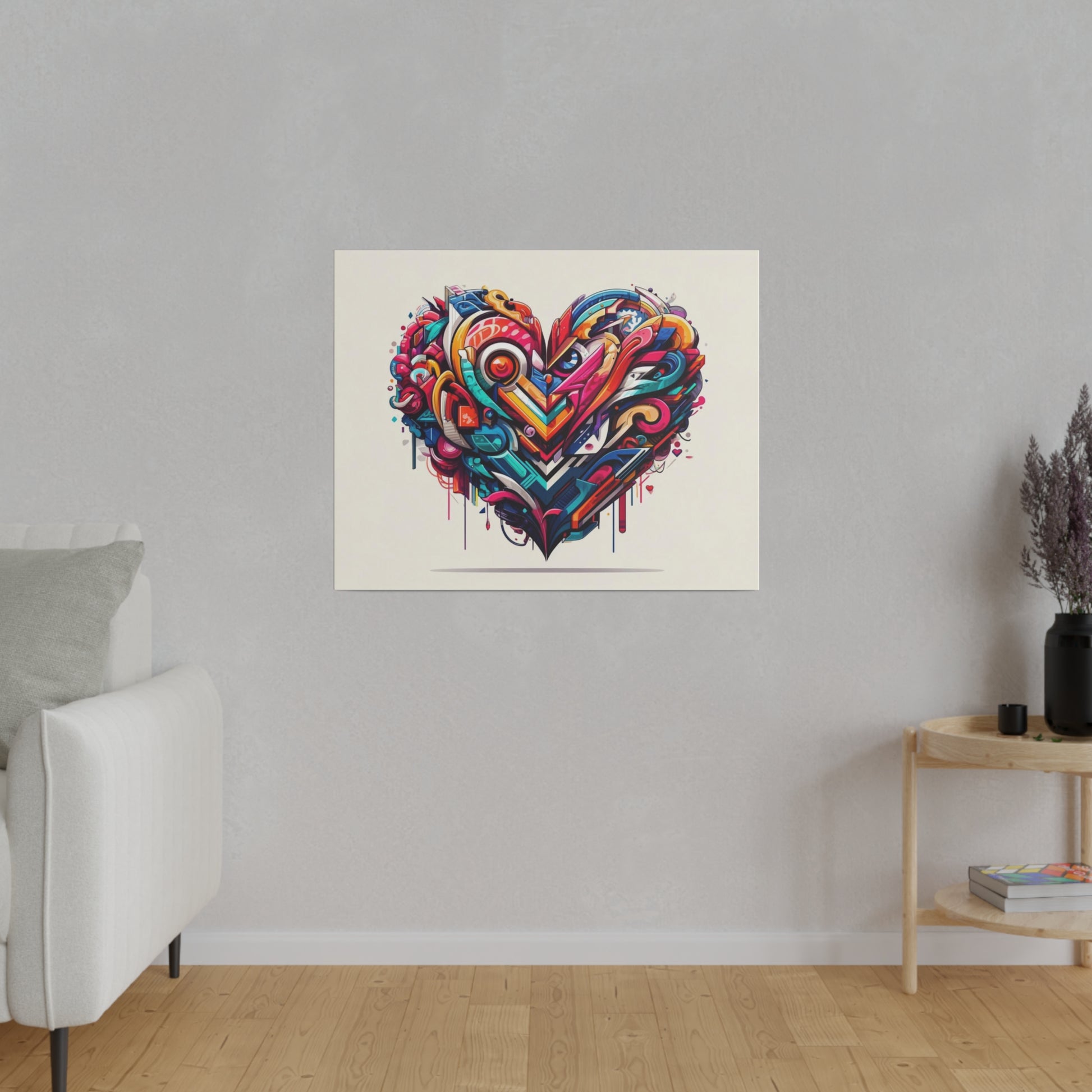 Colorful graffiti-style heart wall art print in red, blue, and yellow tones, hung on a light beige wall.