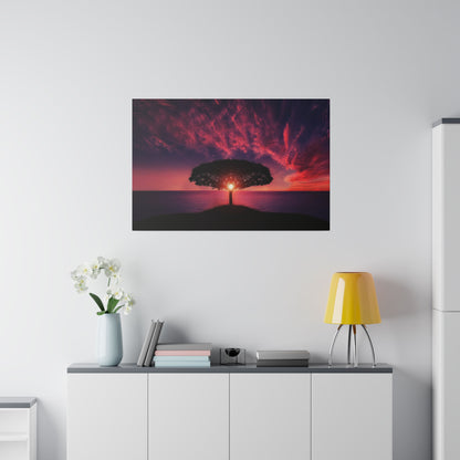 Framed landscape photo of a lone tree on a hill at sunset, with a purple-red sky over the sea.