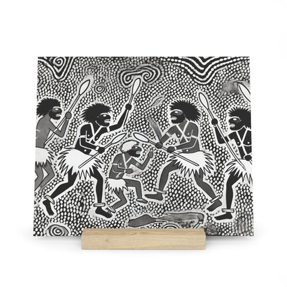 Black-and-white illustration of several tribal men in grass skirts, holding spears and clubs, performing around a central fire.