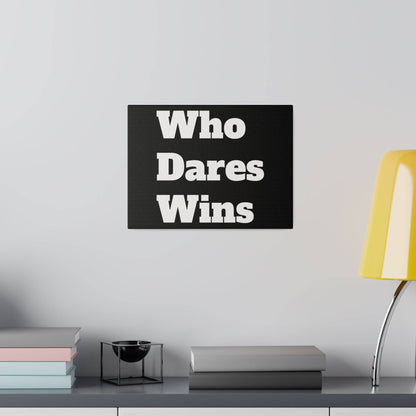 Black rectangular sign with large white text "Who Dares Wins" mounted on a light gray wall above a shelf.