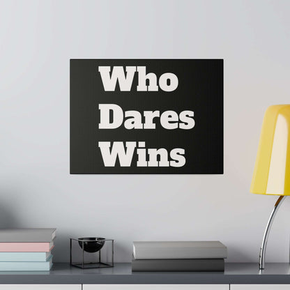 Black canvas print with bold white lettering reading "Who Dares Wins" hanging above a shelf.