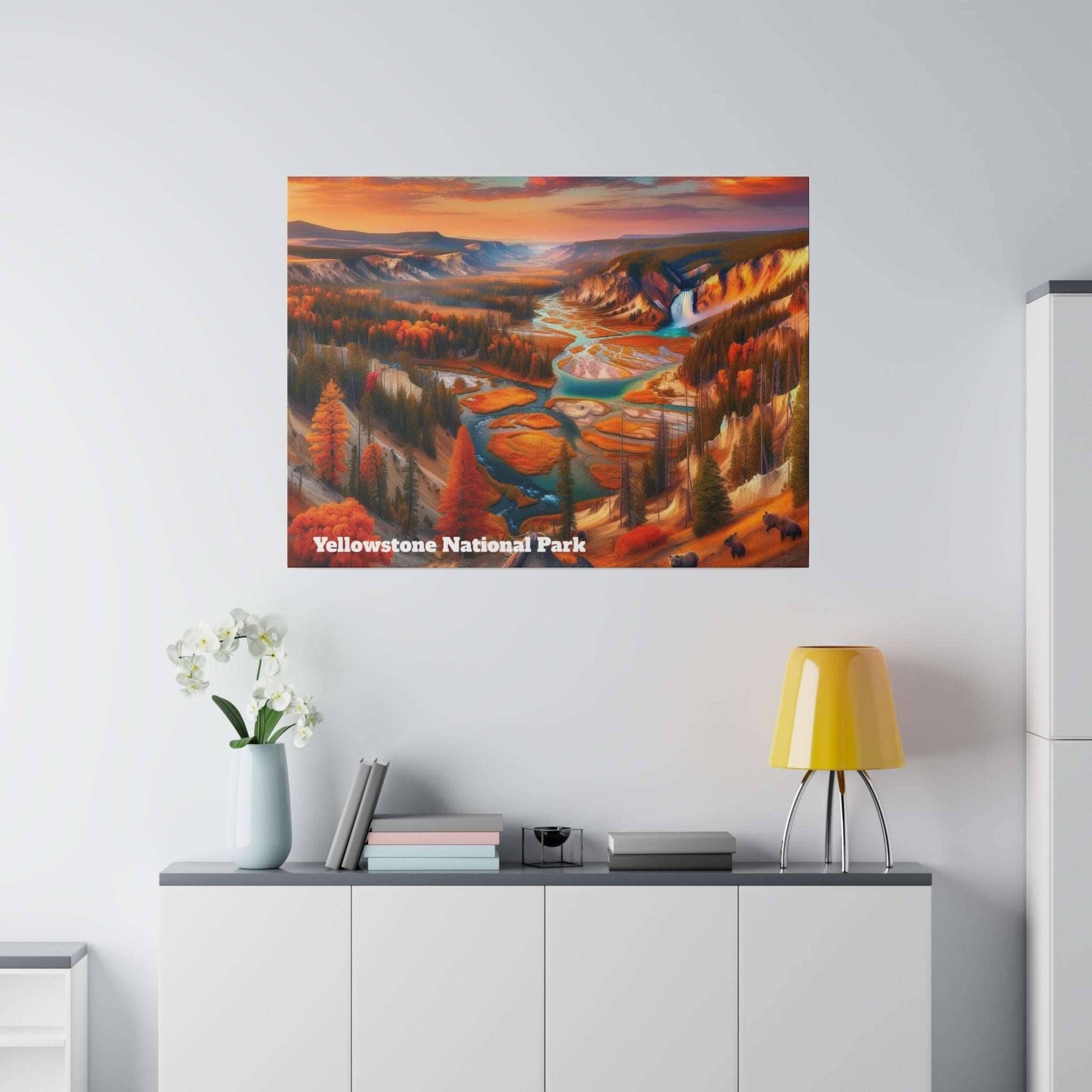 Canvas print of Yellowstone National Park with orange autumn trees and a winding river, hung on a light gray wall.